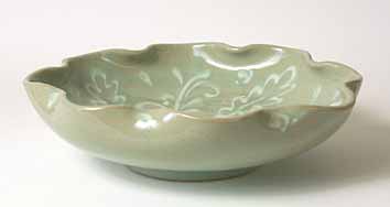 Shallow green decorated bowl